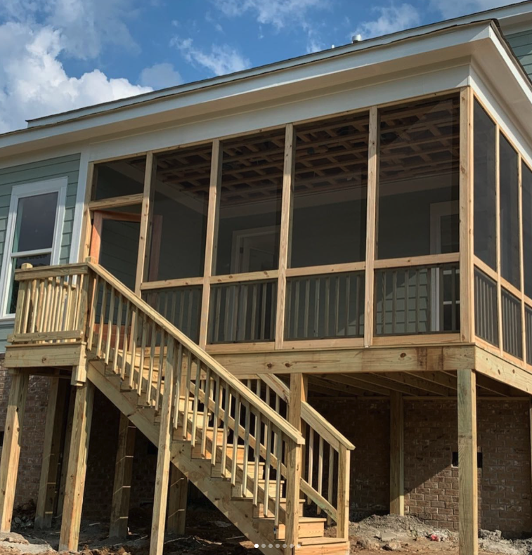 Screened-in porch with wood framing and stairs